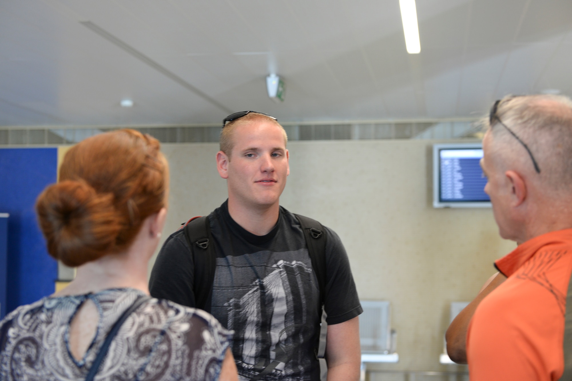 Airman 1st Class Spencer Stone, 65th Medical Operations Squadron ambulance service technician is greeted by Lt. Col. Richard Smith, 65th Air Base Group Medical Operations and Support Squadron commander, and Staff Sgt. Sarah Thomas, 65th Medical Group medical technician,  at Lajes Field. Azores  Sept 22, 2015. Stone, along with childhood friends Aleksander Skarlatos and Anthony Sadler, was recently honored by U.S. President Barack Obama at the White House for subduing an armed gunman when he entered their train carrying an assault rifle, a handgun and a box cutter.  Stone is returning to his home unit for the first time in nearly a month after receiving medical care and traveling throughout the U.S. after the Paris train attack incident.   (U.S Air Force photo/1st Lt. Alexandra Trobe). 