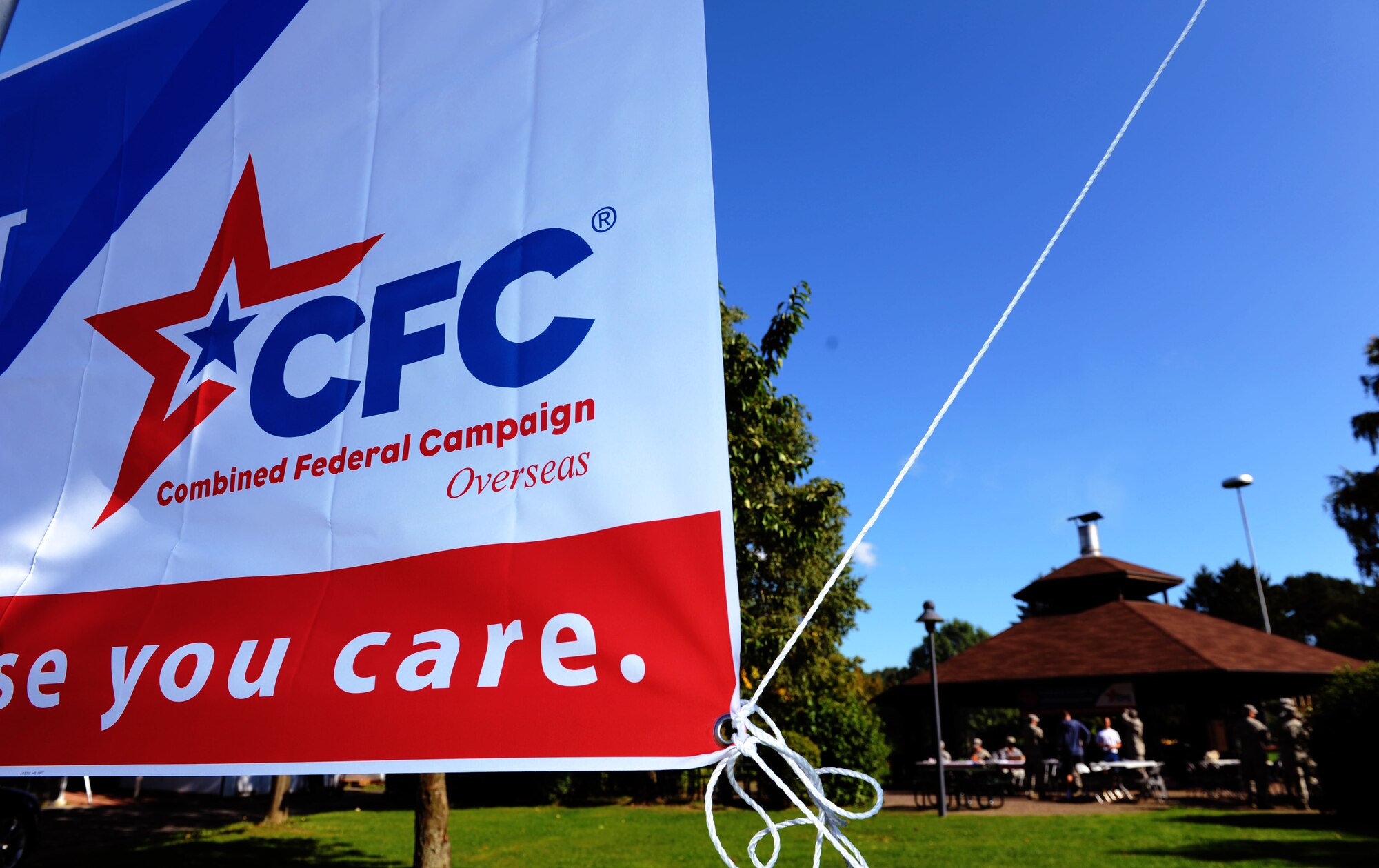 The Combined Federal Campaign Overseas banner flies during the CFC-O kickoff at the base pavilion on Spangdahlem Air Base, Germany, Sept. 21, 2015. The kick-off started at 12 p.m. and lasted until 2 p.m., offering the base community free food, outdoor activities and a means to give to the charities of their choice. The campaign’s mission is to promote and support philanthropy through a program that is employee-focused, cost-efficient and effective in providing all federal employees the opportunity to improve the quality of life for all. (U.S. Air Force photo by Airman 1st Class Timothy Kim/Released) 