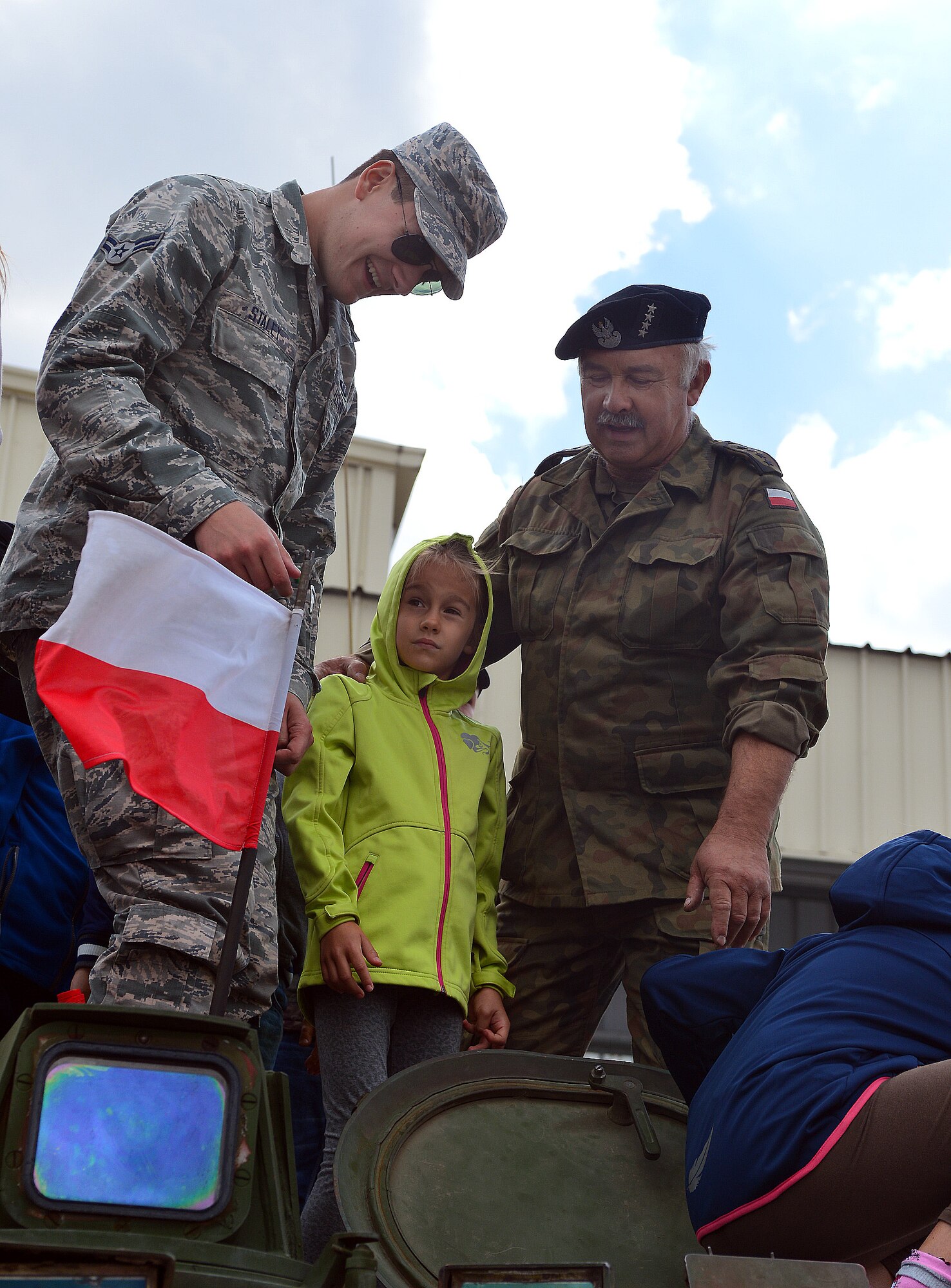 U.S. Air Force Airman 1st Class Zachary Staley, a surveillance technician for the 606th Air Control Squadron, looks inside a static display vehicle during Feast of the 31st Tactical Air Base Poznań-Krzesiny at Krzesiny Air Base, Poland Sept. 5, 2015. The celebration included a variety of static displays, including vehicles and aircraft from throughout Poland’s military history. (U.S. Air Force photo by 2nd Lt. Meredith Mulvihill/Released)