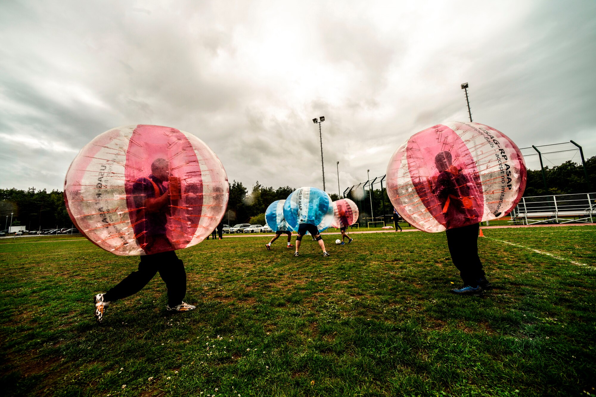 Airmen and Soldiers play bubble soccer at the Combined Federal Campaign-Overseas kickoff Sept. 15, 2015, on Vogelweh Military Complex, Germany. For the second year, the Air Force team won against the Army. (U.S. Air Force photo/Senior Airman Nicole Sikorski)