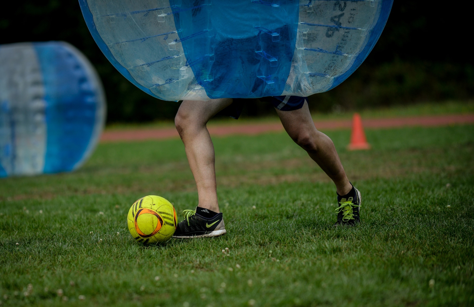 An Airman kicks a soccer ball during a bubble soccer game Sept. 15, 2015, on Vogelweh Military Complex, Germany.  The soccer game was a fundraiser that kicked off the Combined Federal Campaign-Overseas annual fundraiser. (U.S. Air Force photo/Senior Airman Nicole Sikorski)
