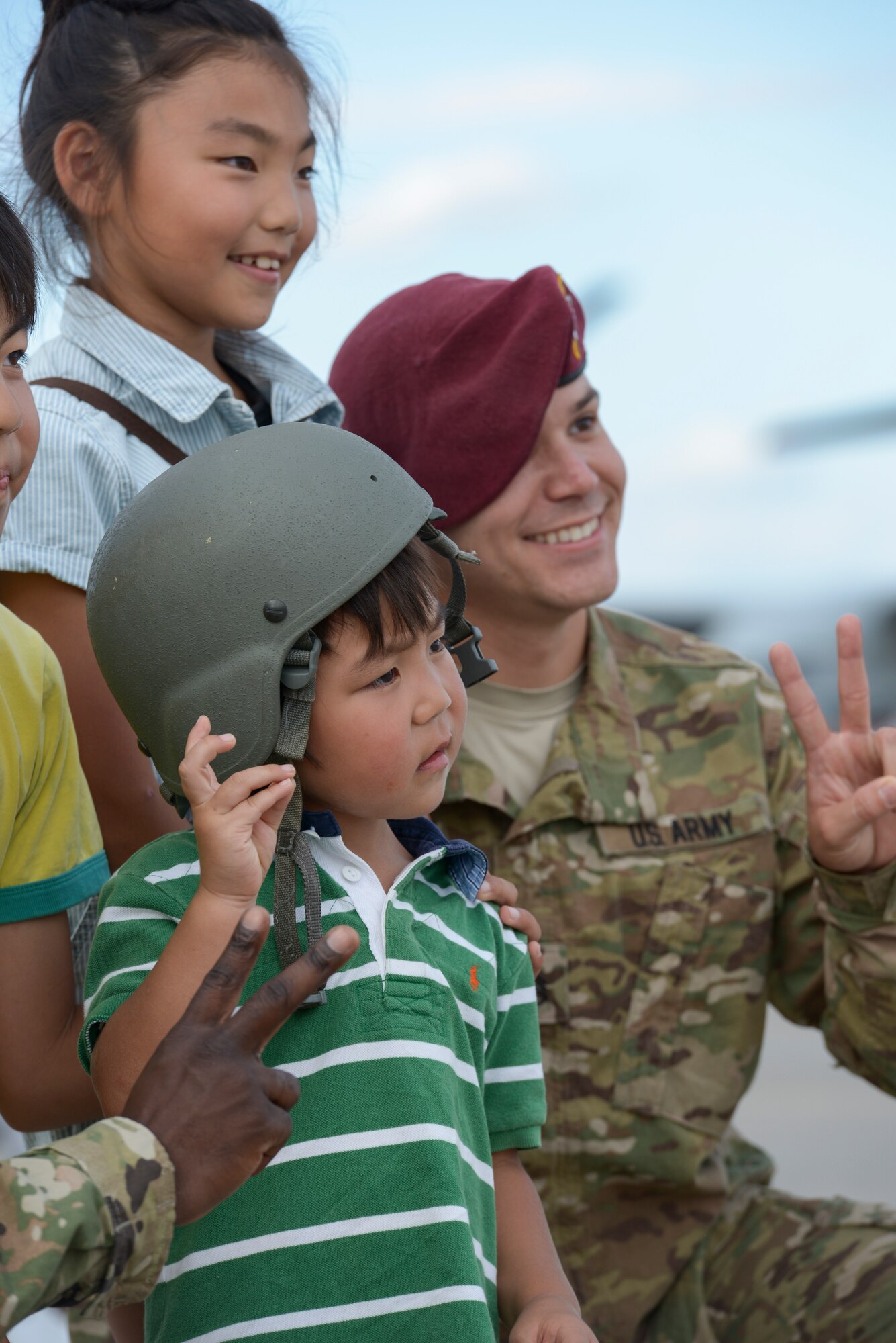 Japanese children take a photo with US Army Staff Sgt. Brian Wright during the 2015 Japanese-American Friendship Festival at Yokota Air Base, Japan, Sept. 20, 2015.
Wright is with the 1st Battalion, 1st Special Operations Group (Airborne), whose members jumped from C-130 Hercules during the festival to highlight the airdrop capability at Yokota. After the jump, the Soldiers greeted festival attendees. (U.S. Air Force photo by Staff Sgt. Cody H. Ramirez/Released)
