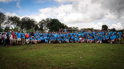 SOTO CANO AIR BASE, Honduras – Volunteers from Joint Task Force-Bravo, the Special Purpose Marine Air Ground Task Force, and the U.S. Embassy in Tegucigalpa pose for a photo following the 63rd JTF-Bravo Chapel Hike in Calavera Centro, Honduras, Sept. 19, 2015. This was the largest Chapel Hike on record, providing 11,500 pounds of donated food, clothing, linen, toiletries and school supplies to the remote villagers before the onset of winter. (U.S. Air Force photo by Capt. Christopher Love)