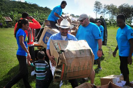 SOTO CANO AIR BASE, Honduras – A man from Calavera Centro, an agricultural community spread across a mountain in La Paz, Honduras, unloads a box of donated goods from a Joint Task Force-Bravo truck, prior to a Chapel Hike ceremony Sept. 19, 2015. The JTF-Bravo Chapel organizes these volunteer events to provide humanitarian assistance to those with material needs in remote regions of Honduras. (U.S. Air Force photo by Capt. Christopher Love)