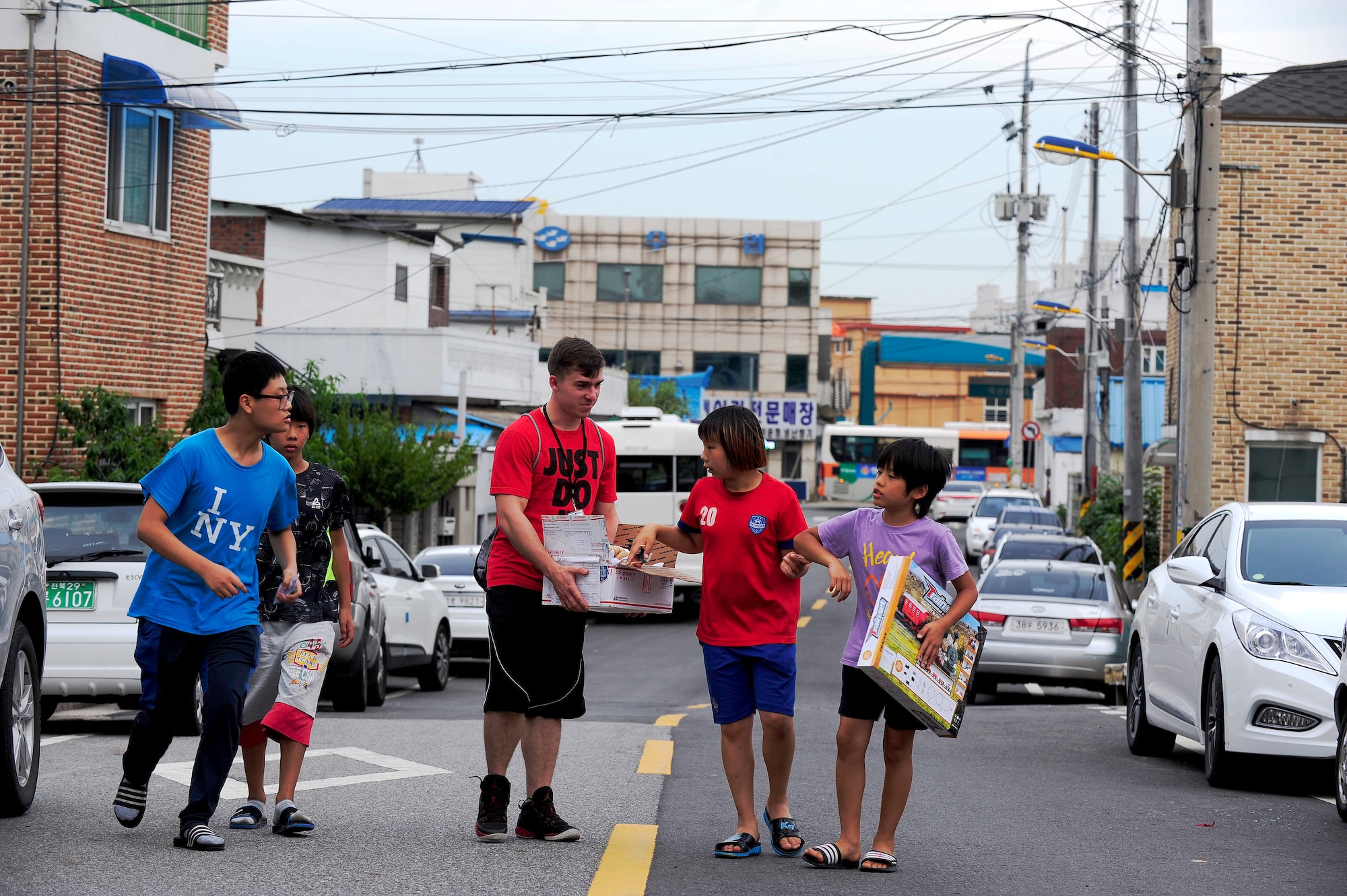 Children from a Welfare Facility pick out toys from a volunteer from Kunsan Air Base, Republic of Korea at Gunsan City, ROK, Aug. 18, 2015. Airmen from Kunsan AB visit the orphanage monthly to bolster relationships with the local community. (U.S. Air Force photo by Staff Sgt. Nick Wilson/Released)