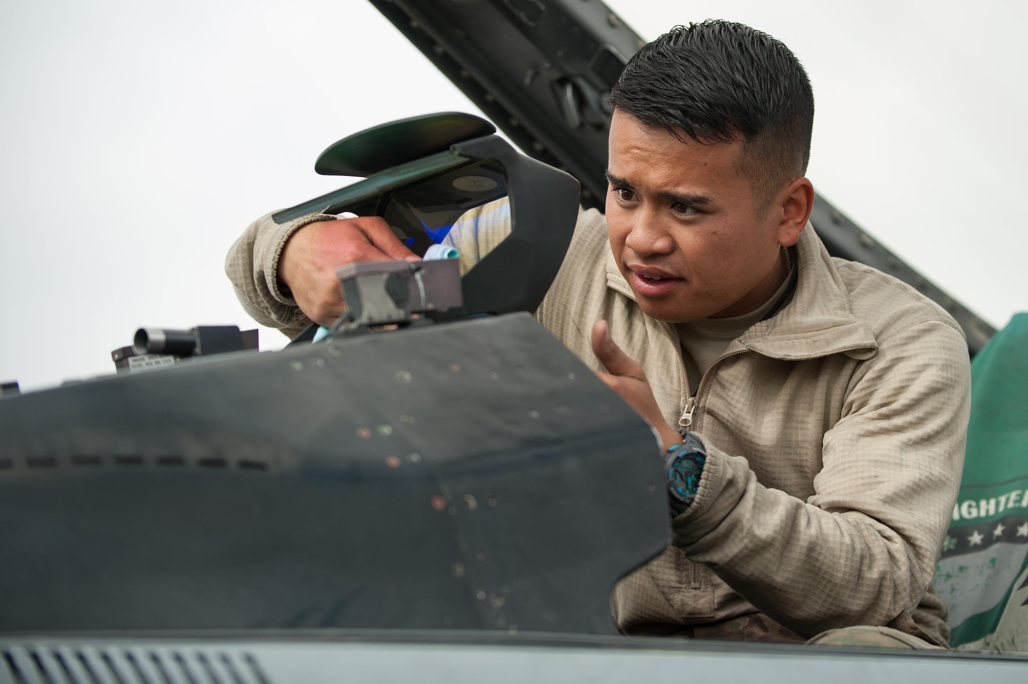 U.S. Air Force Airman 1st Class Jay Chhoeun, assigned to the 455th Expeditionary Maintenance Squadron, cleans the screen on an F-16 Fighting Falcon aircraft at Bagram Airfield, Afghanistan, Sept. 22, 2015. The F-16 is a multi-role fighter aircraft that is highly maneuverable and has proven itself in air-to-air and air-to-ground combat. (U.S. Air Force photo by Tech. Sgt. Joseph Swafford/Released)