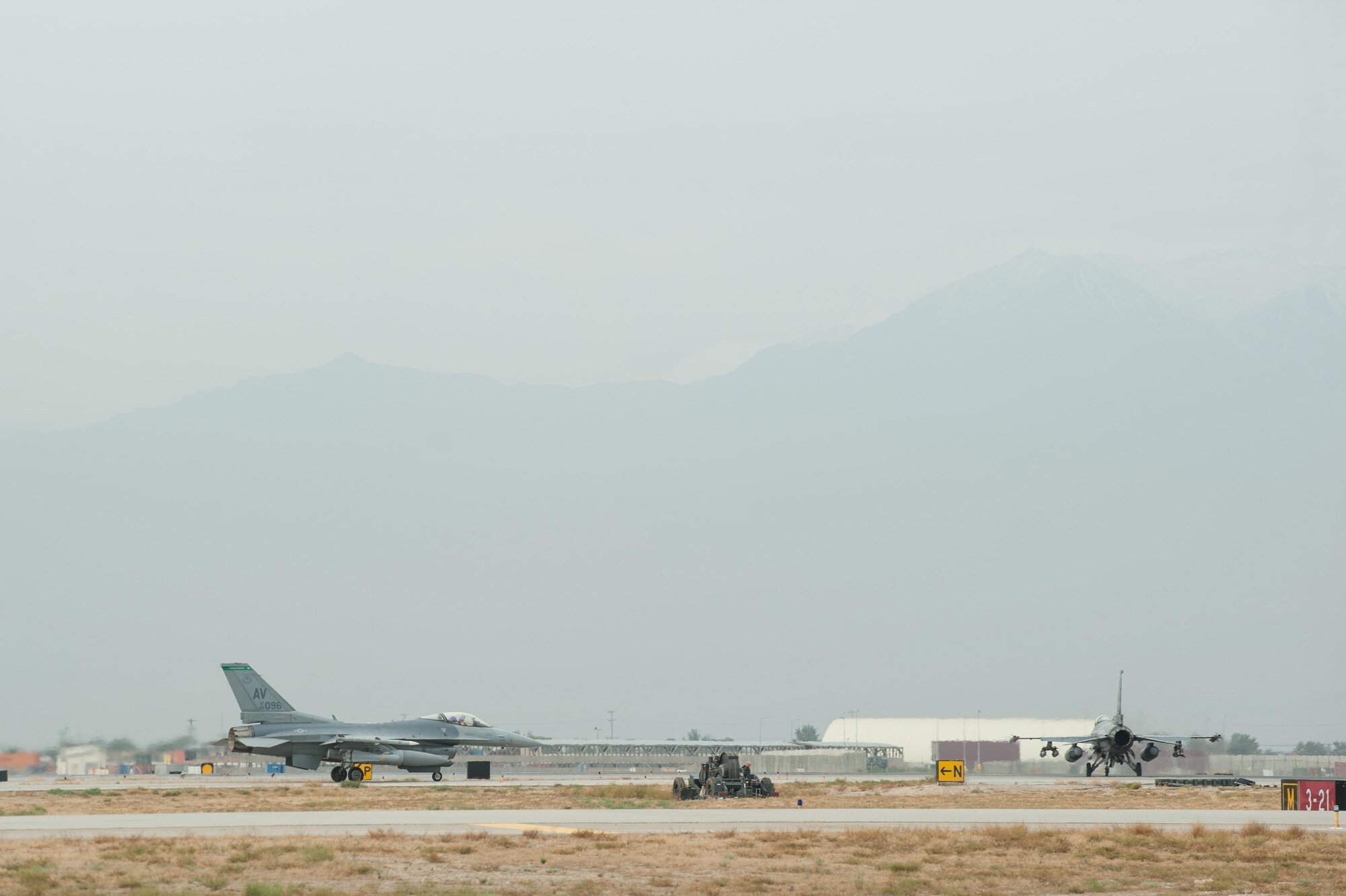 U.S. Air Force F-16 Fighting Falcon aircraft assigned to the 555th Expeditionary Fighter Squadron taxi before taking off on a combat sortie from Bagram Airfield, Afghanistan, Sept. 22, 2015. The F-16 is a multi-role fighter aircraft that is highly maneuverable and has proven itself in air-to-air and air-to-ground combat. (U.S. Air Force photo by Tech. Sgt. Joseph Swafford/Released)