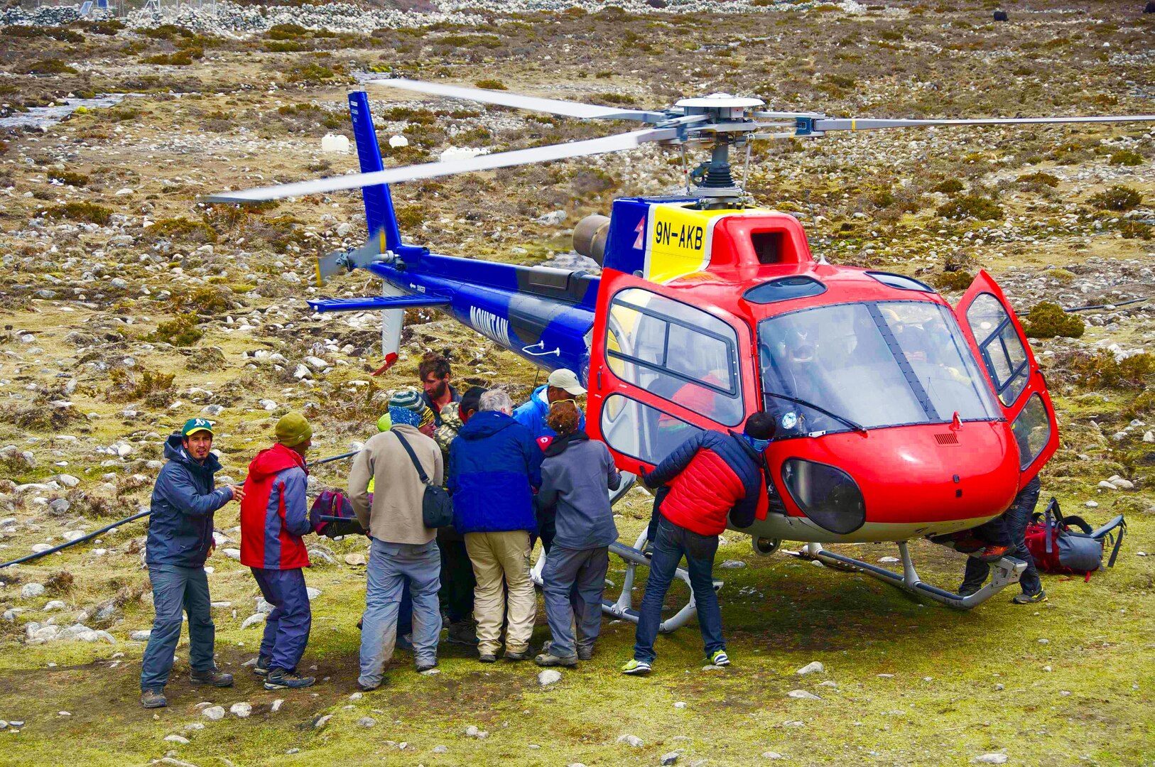 Maj. Asif Anwar and others load a patient into a rescue helicopter on Mount Everest in Nepal after a magnitude 7.8 earthquake rocked the region April 25. Anwar, a flight surgeon with the Wisconsin Air National Guard’s 128th Air Refueling Wing, treated more than 500 patients on Mount Everest and in Katmandu, Nepal, in the days following the earthquake. 