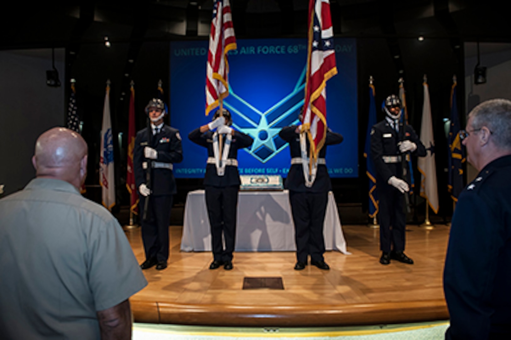 Members of the Air Force Junior ROTC OH-871 present the colors to kick off DLA Land and Maritime’s Air Force 68th birthday celebration Sept. 17 in the Building 20 auditorium. In the foreground is Navy Rear Adm. John King (left), Land and Maritime commander, and Air Force Maj. Gen. Mark Bartman, Adjutant General, Ohio National Guard. 