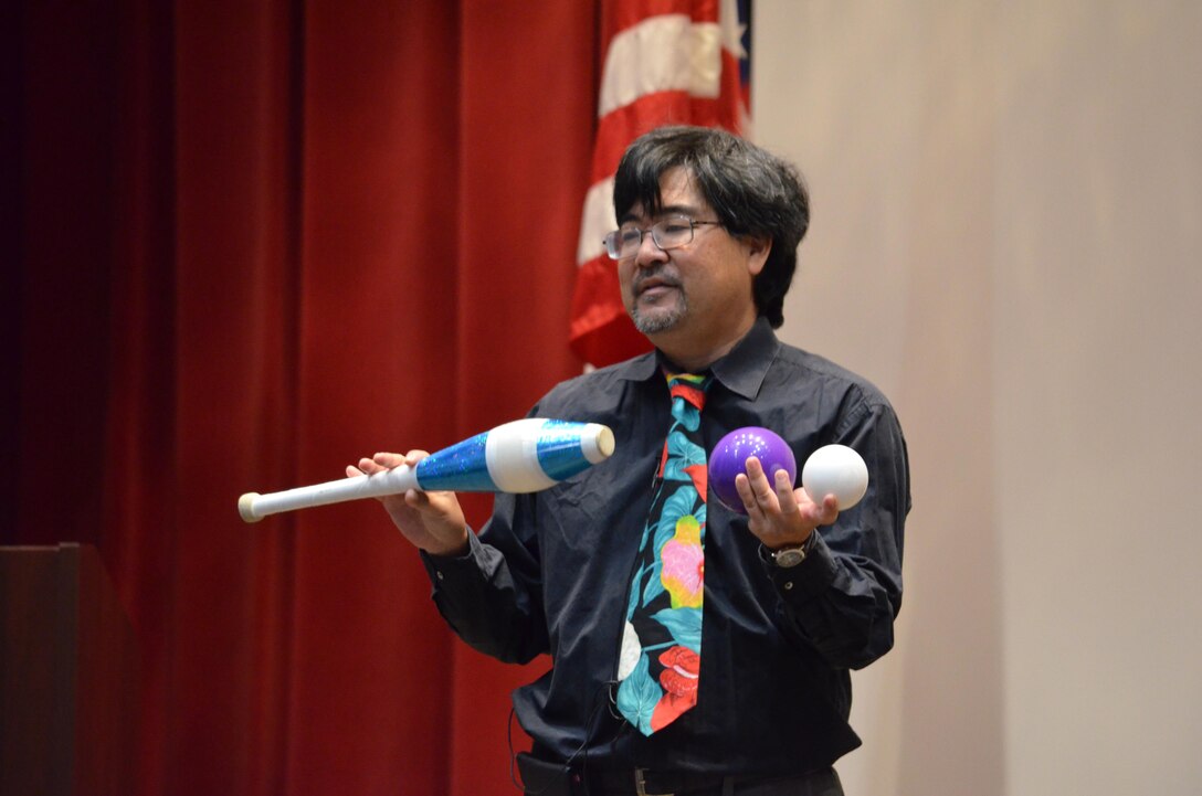 MARINE CORPS BASE QUANTICO, Va. – Dr. Eric Shibuya, a professor at Marine Corps Command and Staff College, prepares to illustrate the complexity of international relations by juggling three different objects. 