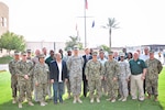 (Center) Navy Rear Adm. Valerie Huegel, U.S. Central Command Deployment and Distribution Operations Center director, poses for a photograph with Defense Logistics Agency personnel at Naval Support Activity Bahrain Sept. 17. During her trip, Huegel toured multiple DLA Energy Middle East buildings and spoke to DLA Energy Middle East employees.