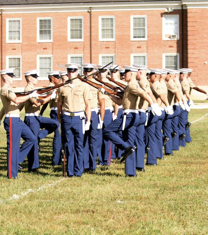 Marines from the Marine Corps Silent Drill Platoon perform for crowds during the Modern Day Marine Military Exposition 2015 Enlisted Awards Parade held at Quantico Sept. 22-24. Today is the final day of the annual exposition.