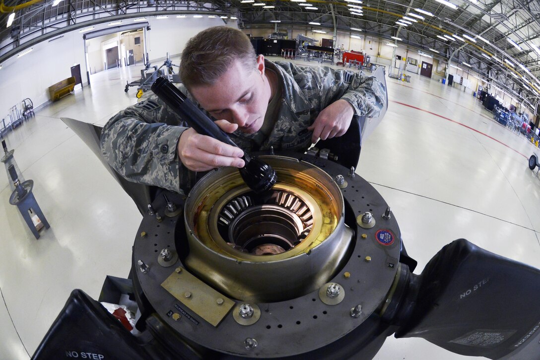Air Force Senior Airman Colton Windsor inspects the blade teeth of a propeller on Yokota Air Base, Japan, Sept. 23, 2015. Windsor is an aerospace propulsion journeyman assigned to the 374th Maintenance Squadron. U.S. Air Force photo by Senior Airman David Owsianka