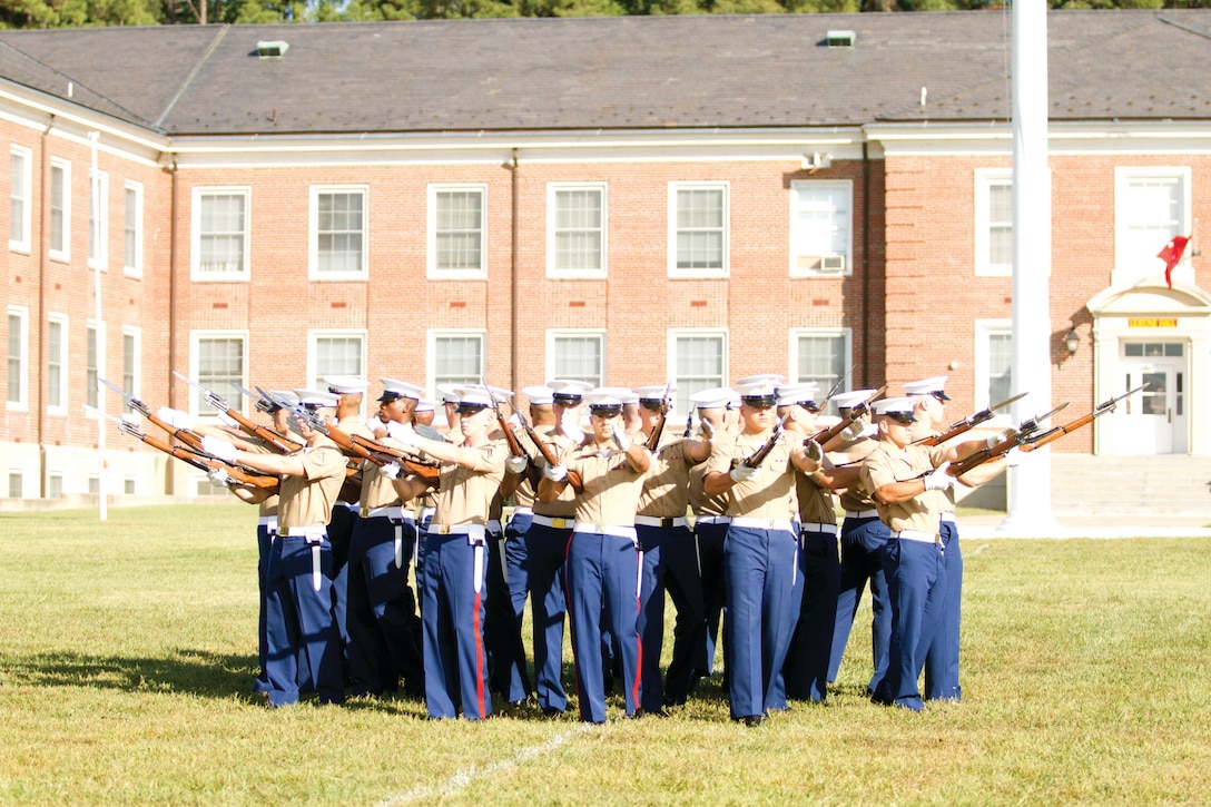 Members of the Marine Corps Silent Drill Platoon stand in phalanx at the 2015 Enlisted Awards Parade and Presentation, held at MCB Quantico on Sept. 23 in conjunction with the Modern Day Marine Military Exposition.