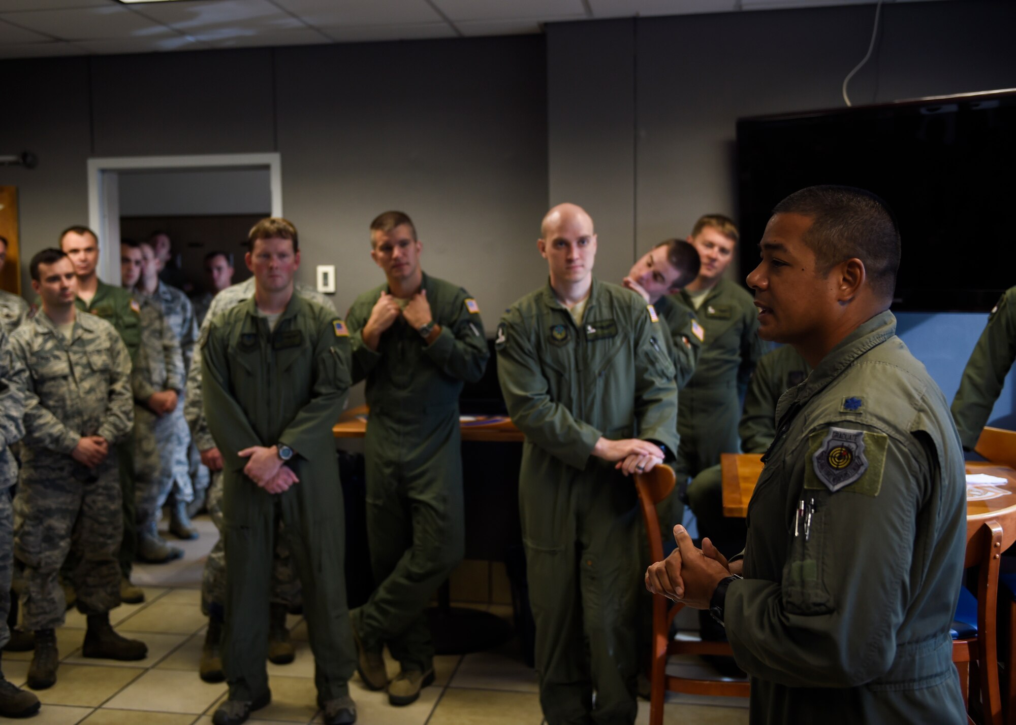 Lt. Col. Derrick Barton, 4th Special Operations Squadron commander, speaks at the first AC-130U Spooky retirement at Hurlburt Field, Fla., Sept. 21, 2015. On July 21, 2011, “Bad Omen” had one of its most successful sorties over Afghanistan. The aircraft arrived on station to support a task force that was infiltrating a compound area when the task force started taking fire from all sides. The gunship began to take direct action, and true to “U” model form, the crew performed eight separate engagements using infrared and TV dual-target attacks firing 146, 40mm cannon rounds and 41, 105mm howitzer rounds to end the engagement. (U.S. Air Force photo by Airman Kai White)