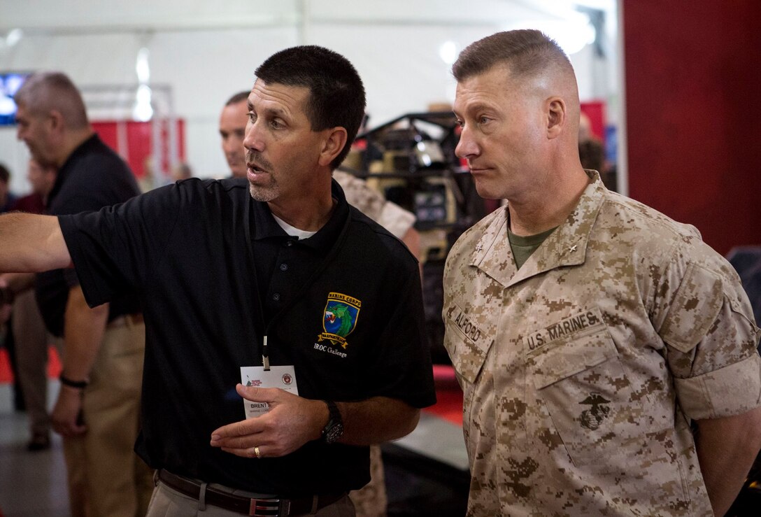 Brent J. Azzarelli, Chief Robotics Engineer, Naval Surface Warfare Center Dahlgren Division (NSWCDD)/Marine Corps Warfighting Lab talks to BGen Dale Alford, Commanding General MCWL/FD about the latest technologies in the command's Science & Technology portfolio.