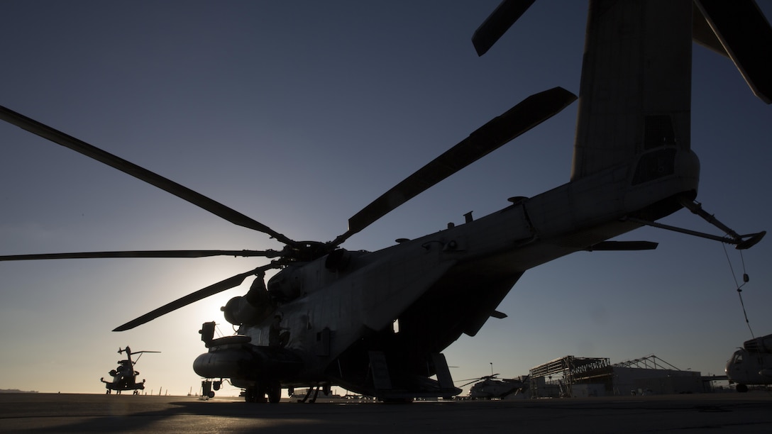 A CH-53E Super Stallion with Marine Heavy Helicopter Squadron 466 waits on the flightline as aircrew Marines conduct preflight checks at Marine Corps Station Miramar, Calif., Sept. 16. Marines with HMH-466 prepared to conduct external-lift training at Marine Corps Base Camp Pendleton, Calif. 