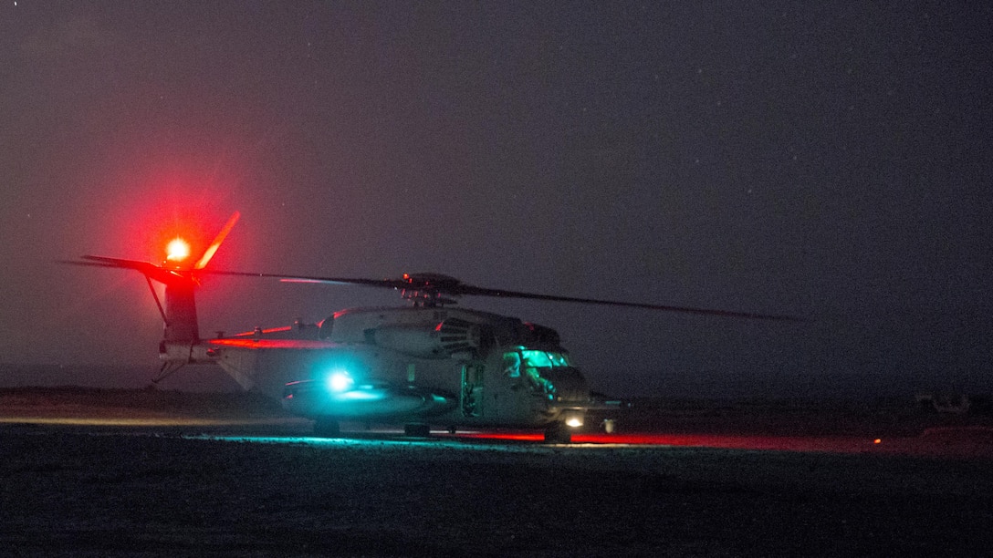 A CH-53E Super Stallion with Marine Heavy Helicopter Squadron 466 lands during nighttime external-lift training at Marine Corps Base Camp Pendleton, Calif., Sept. 16.  Marines with Combat Logistics Battalion 1 and HMH-466 conducted external-lift training to practice effective communication and cooperation between air and ground units in low-light conditions. 