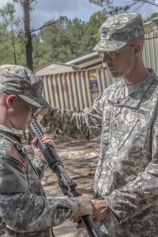 Army Reserve Drill Sergeant of the Year contestant, Staff Sgt. Mark Mercer, 95th Training Division (IET), teaches a Basic Combat Training Soldier inspection arms by the numbers during the third day of the four-day TRADOC Drill Sergeant of the Year competition held at Fort Jackson, S.C., Sept. 7-10, 2015. Mercer is in a head-to-head competition with Staff Sgt. Russell Vidler, 98th Training Division (IET), for the title of Army Reserve's top drill sergeant. (U.S. Army photo by Sgt. 1st Class Brian Hamilton)