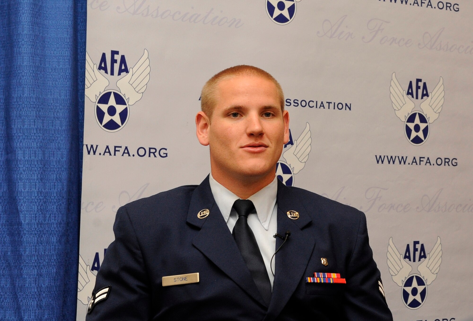 Airman 1st Class Spencer Stone answers questions during an interview at the Air Force Association’s Air and Space Conference and Technology Exposition in Washington, D.C., Sept. 16. (U.S. Air Force photo by Staff Sgt. Whitney Stanfield/Released)