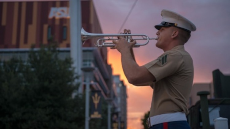Cpl. Drew Blincoe plays morning reveille at Civic Space Park in Phoenix, Sept. 9, 2015, part of Marine Week Phoenix. Marine Week Phoenix gives the people of Phoenix an opportunity to see Marine Corps history, traditions and values.