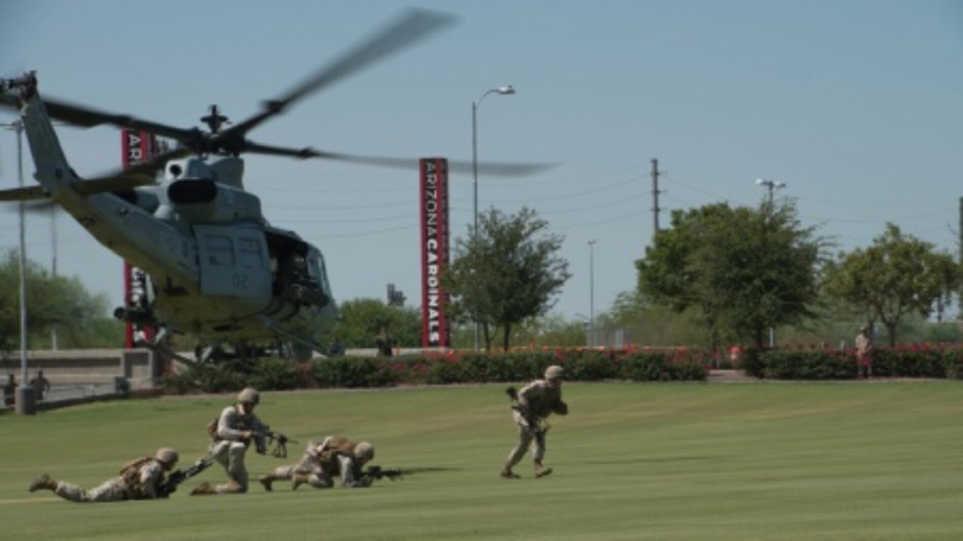 Marines rush from a UH-1Y Huey at the fields behind the University of Phoenix Stadium at Glendale, Arizona, Sept. 11, 2015. The demonstration was part of Marine Week Phoenix, which allows the Marine Corps to showcase its traditions, history, and values.
