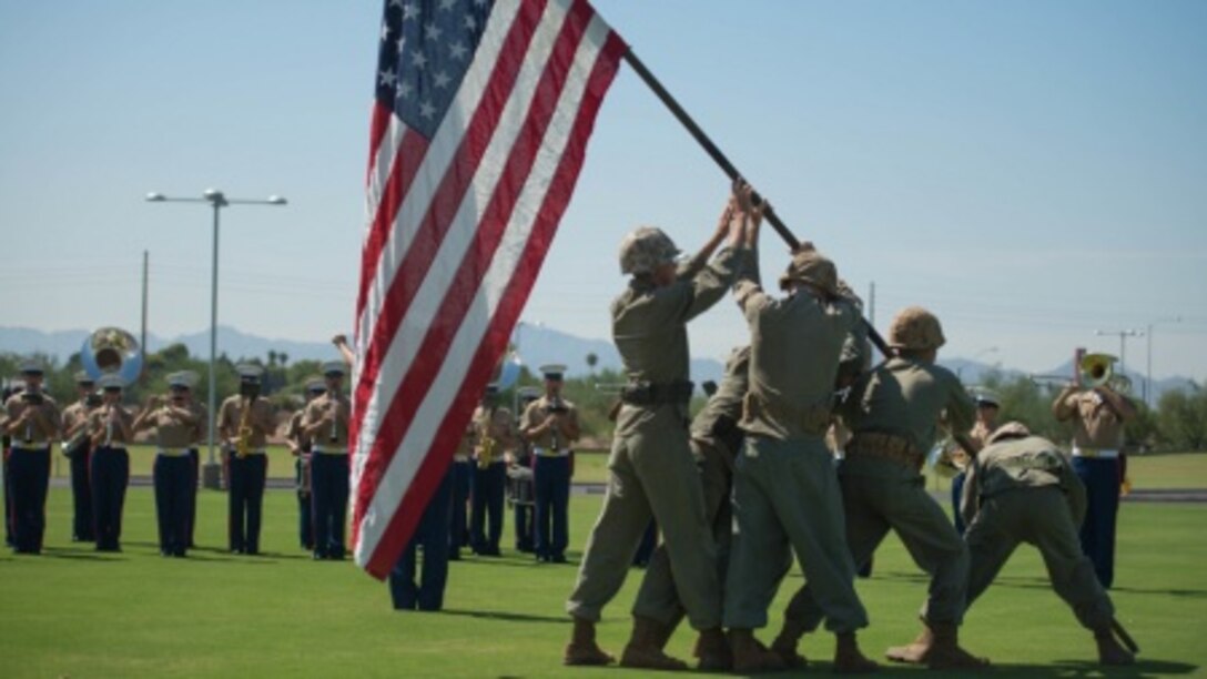 A group of Marine role players reenact the flag raising on Iwo Jima at the fields behind the University of Phoenix Stadium at Glendale, Arizona, Sept. 11, 2015. The demonstration was part of Marine Week Phoenix, which allows the Marine Corps to showcase its traditions, history, and values.
