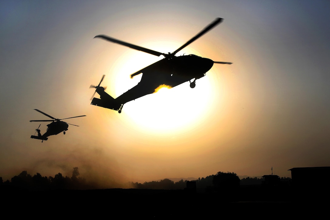 UH-60 Black Hawk helicopters hover over a landing zone before conducting air assault training on Jalalabad Airfield in eastern Afghanistan, Sept. 16, 2015. The soldiers are assigned to the 101st Airborne Division's 3rd Brigade Combat Team. U.S. Army photo by Capt. Charles Emmons