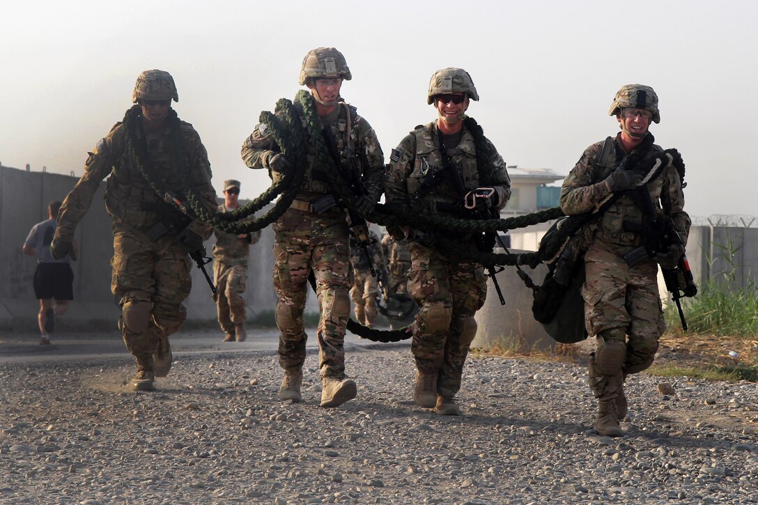 U.S. soldiers carry a heavy rope during the physical fitness portion of their air assault training on Jalalabad Airfield in eastern Afghanistan, Sept. 16, 2015. The soldiers are assigned to the 101st Airborne Division's 3rd Brigade Combat Team. U.S. Army photo by Capt. Charles Emmons