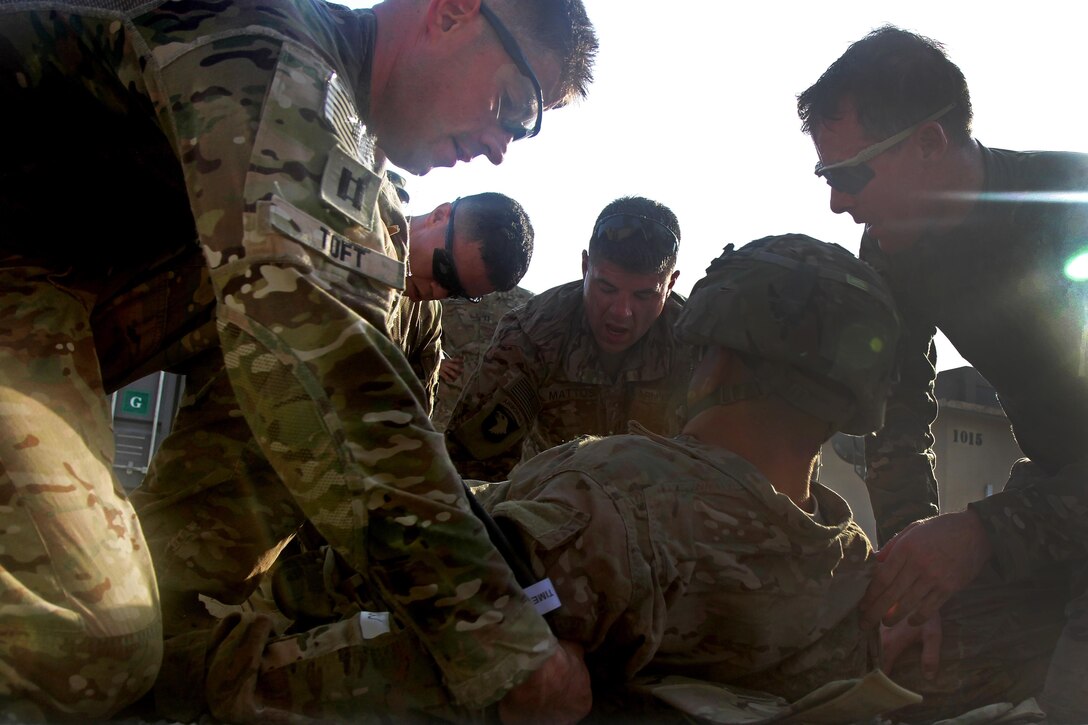 U.S. soldiers assess and treat a simulated casualty during air assault training on Jalalabad Airfield in eastern Afghanistan, Sept. 16, 2015. U.S. Army photo by Capt. Charles Emmons