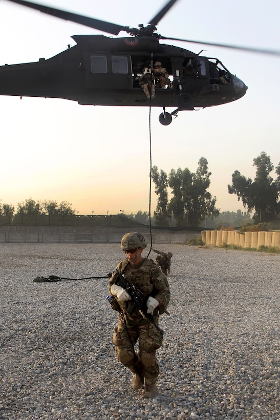 U.S. Army Capt. Bryan Spear hurries off the landing zone after fast-roping during air assault training on Jalalabad Airfield in eastern Afghanistan, Sept. 16, 2015. Spear is assigned to the 101st Airborne Division's 3rd Brigade Combat Team. U.S. Army photo by Capt. Charles Emmons