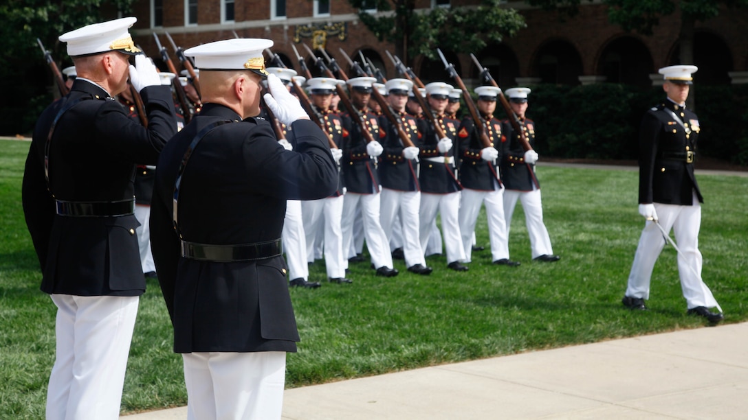 Gen. Robert B. Neller, right, and Joseph F. Dunford, Jr., salute during a pass in review during their passage of command ceremony at Marine Corps Barracks Washington, D.C., Sept. 24, 2015. Gen. Dunford, 36th and former Commandant of the Marine Corps, relinquished the position to Gen. Robert B. Neller, the 37th and new Commandant of the Marine Corps.