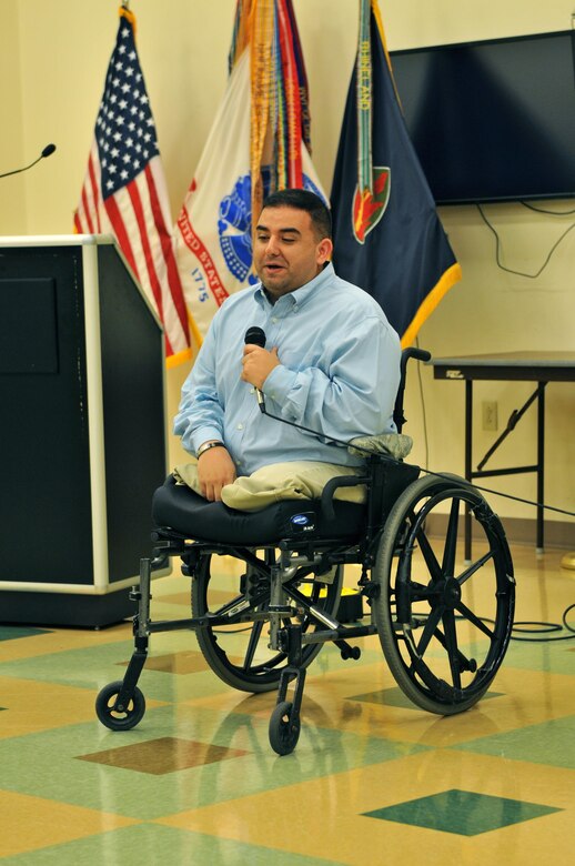 Retired Army Sgt. Manny Mendoza-Valencia talks about his life and love of Hispanic culture to the audience at the 63rd Regional Support Command’s National Hispanic Heritage Month event, Sept. 22, at the headquarters building, Moffett Field, Calif. Valencia, who was one of the guest speakers at the event, lost his legs to an improvised explosive device in Sadr City, Iraq, in 2004.