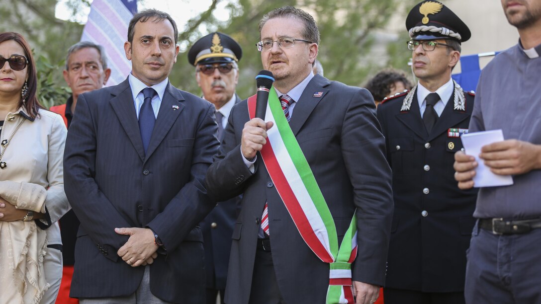 Armando Glorioso, mayor of Nissoria, speaks to the citizens of his town and U.S. service members present during a September 11th remembrance ceremony in Nissoria, Italy, Sept. 22, 2015. Marines and sailors with Special-Purpose Marine Air-Ground Task Force Crisis Response-Africa were invited to the town’s ceremony remembering the lives of two Nissorian citizens and all the other lives lost in that tragedy. 