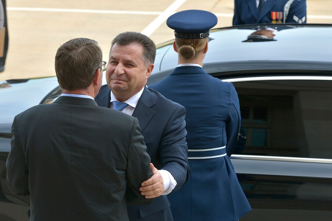 U.S. Defense Secretary Ash Carter embraces Ukrainian Defense Minister Col.-Gen. Stepan Poltorak as he arrives at the Pentagon, Sept. 24, 2015. Carter welcomed Poltorak with an honor cordon, met with him to discuss matters of mutual importance and held a joint press conference after their meeting. DoD photo by Glenn Fawcett 