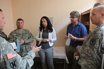 Left to right, Army Maj. Kevin Kaufman, Army Sgt. Jonathan Hall, both with the 457th Civil Affairs Battalion, 7th Civil Support Command and Diana Marsic, a U.S. Embassy-Croatia liaison/ Humanitarian Assistance project coordinator meet with Dr. Vladimir Delipetar, the director of the emergency service clinic in Imotski during assessments of European Command’s HA program funded defibrillators and donated medical equipment/supplies, Sept. 11, 2015, while Army Pfc. Carl Youngblood, a civil affairs specialist, 457th CA Bn., 7th CSC,  listens in Imotski, Croatia.