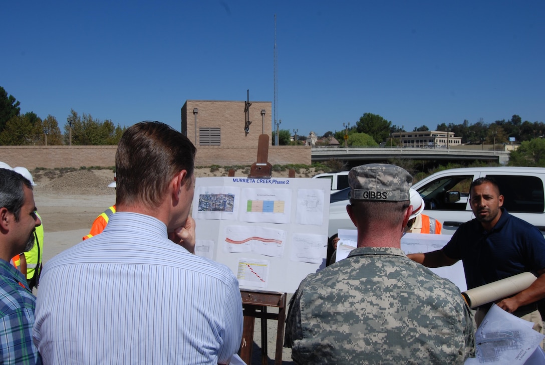 Jose Rocha (right), the Corps' lead engineer on the Murrieta Creek project, describes its current status to Los Angeles District Commander Col. Kirk Gibbs, during a Sept. 23 visit to the project. The visit included discussions with Dusty Williams, the general manager and chief engineer of the Riverside County Flood Control & Water Conservation District, about the ongoing work in the channel and the goals and obstacles to providing long-term flood risk reduction for the area’s residents and businesses.