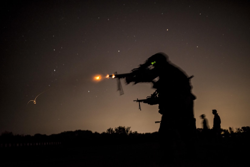 Canadian and British Army soldiers participate in a light machine gun night fire event during the 2015 Canadian Armed Forces Small Arms Concentration at the Connaught Range outside of Ottawa, Canada, Sept. 14. The marksmanship competition brought in more than 250 total competitors from the British, Canadian and U.S. armed forces competing in more than 50 matches involving rifle, pistol and light machine gun events using various combat-like movements and scenarios. (U.S. Army photo by Master Sgt. Michel Sauret)