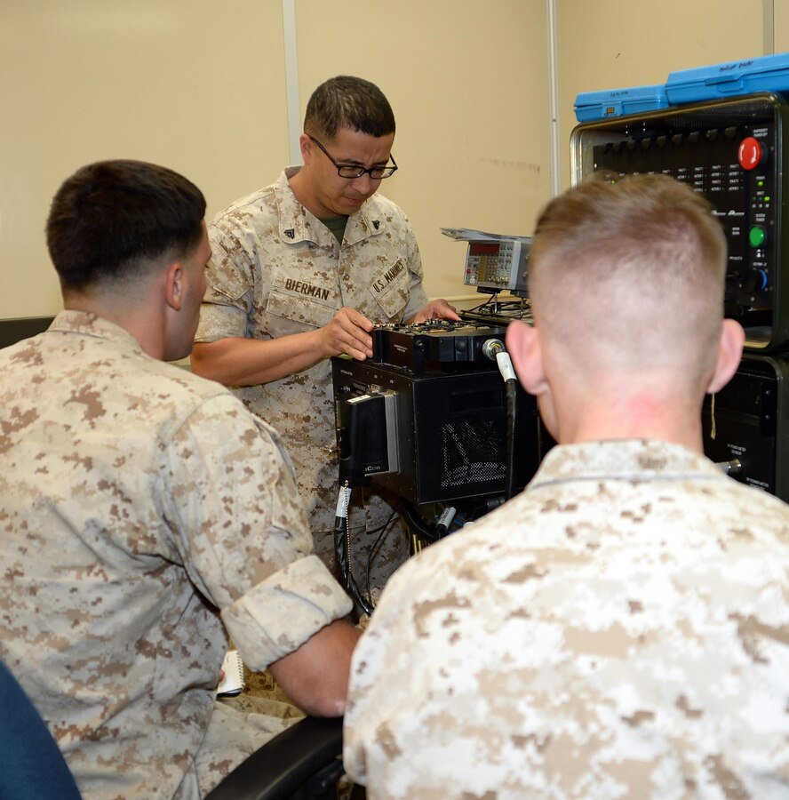 Marine reservists from Detachment 4, Combat Logistics Battalion-451, test A circuit card assembly for errors and faulty components of a Third Echelon Test System at Marine Depot Maintenance Command during their annual training aboard Marine Corps Logistics Base Albany, Sept. 22.