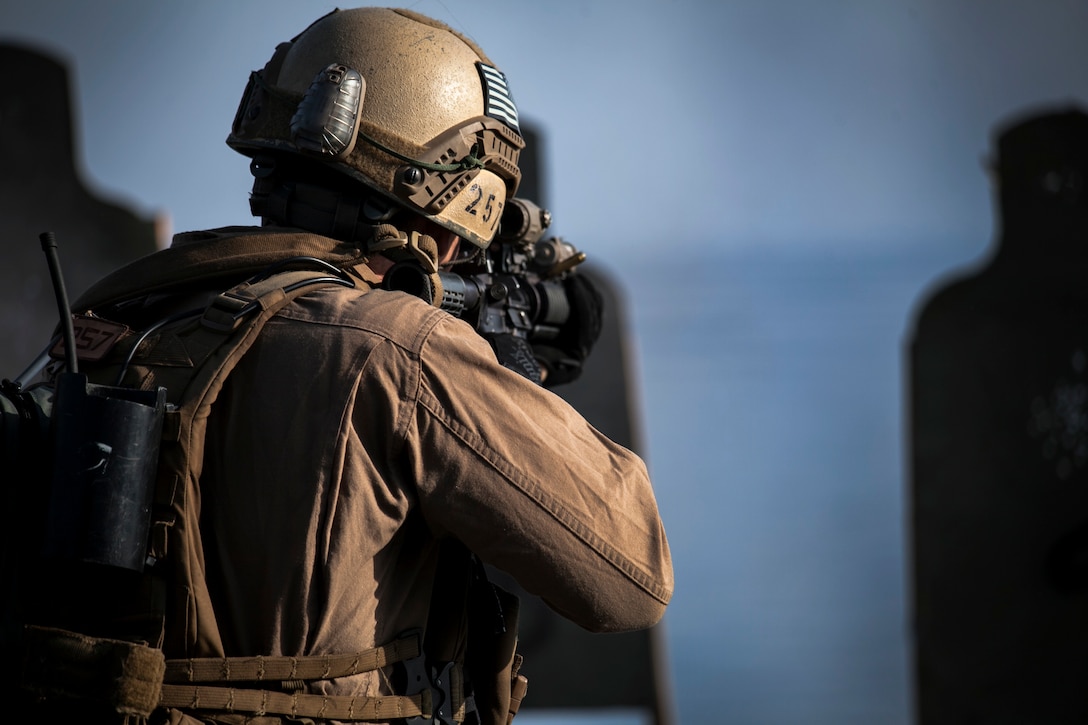 A U.S. Marine engages his target during a deck shoot aboard the USS Essex in the Persian Gulf, Sept. 21, 2015. The Marine is with the 15th Marine Expeditionary Unit’s Maritime Raid Force. U.S. Marine Corps photo by Cpl. Elize McKelvey