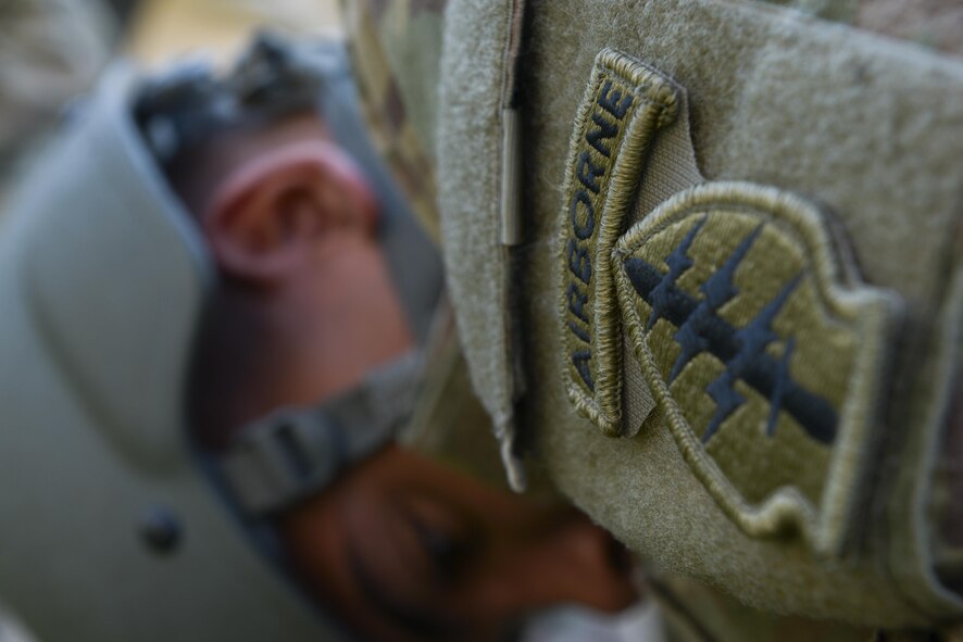 A member of the1st Battalion, 1st Special Operations Group (Airborne), conducts pre- jump practice drills before boarding a C-130 Hercules during the 2015 Japanese- American Friendship Festival at Yokota Air Base, Japan, Sept. 20, 2015. The airborne members jumped from C-130s during the two-day event, showcasing the airdrop capabilities at Yokota. (U.S. Air Force photo by Staff Sgt. Cody H. Ramirez/Released)