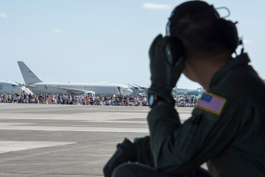 Crowds watch as a C-130 Hercules taxis to the runway during the 2015 Japanese- American Friendship Festival at Yokota Air Base, Japan, Sept. 20, 2015. More than 185,000 people attended the two-day festival. (U.S. Air Force photo by Staff Sgt. Cody H. Ramirez/Released) 