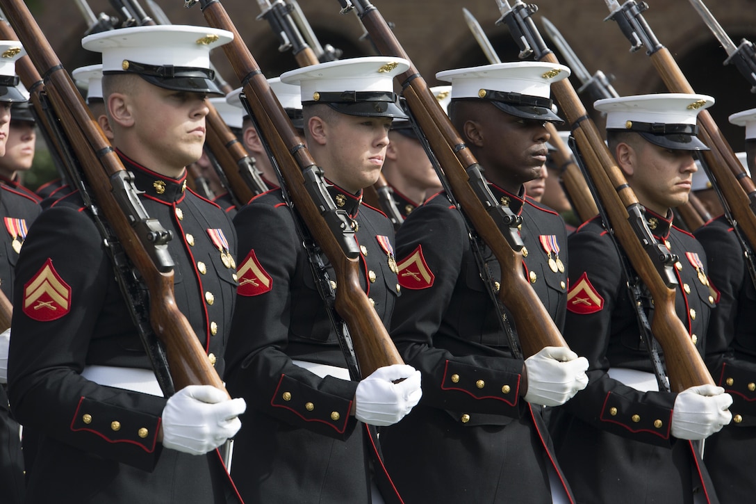 Marines from Alpha Company perform during the Passage of Command between Gen. Joseph F. Dunford Jr., 36th commandant of the Marine Corps, and Gen. Robert B. Neller, 37th commandant of the Marine Corps, at Marine Barracks Washington, D.C., Sept. 24, 2015.