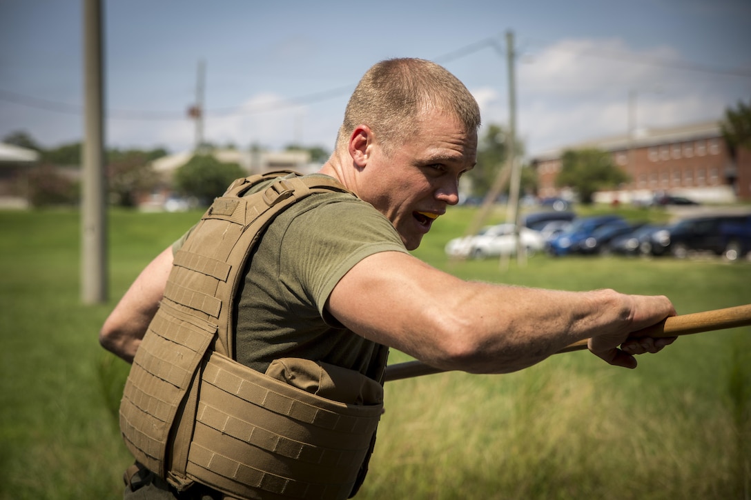 A sailor with 2nd Dental Battalion, 2nd Marine Logistics Group practices bayonet techniques during a Marine Corps Martial Arts Program course at Marine Corps Base Camp Lejeune, N.C., Sept. 11, 2015. The MCMAP course was part of a week-long training event where the sailors also conducted combat lifesaving and tactical casualty care training.