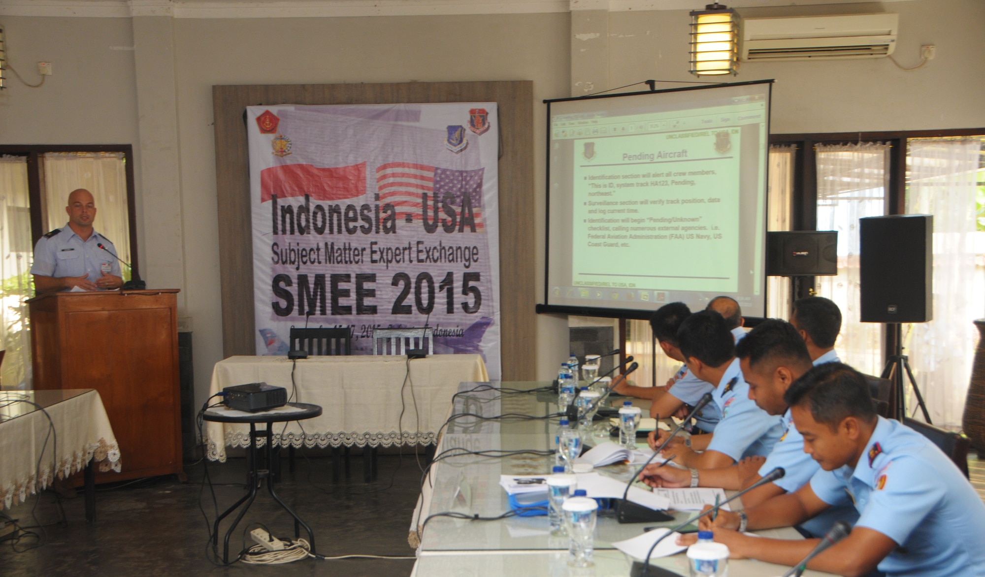 Maj. Michael Odonnell, Mission Crew Commander with the 169th Air Defense Squadron conducts a brief on pending aircraft to members of the Kohanudnas, the Indonesian Armed Forces component responsible for air defense, Sept. 17, 2015, Jakarta, Indonesia. As part of the National Guard's State Partnership Program, members of the HIANG participated in an air defense subject matter expert exchange with counterparts from Indonesia. (U.S. Air National Guard photo by Senior Airman Orlando Corpuz/released)