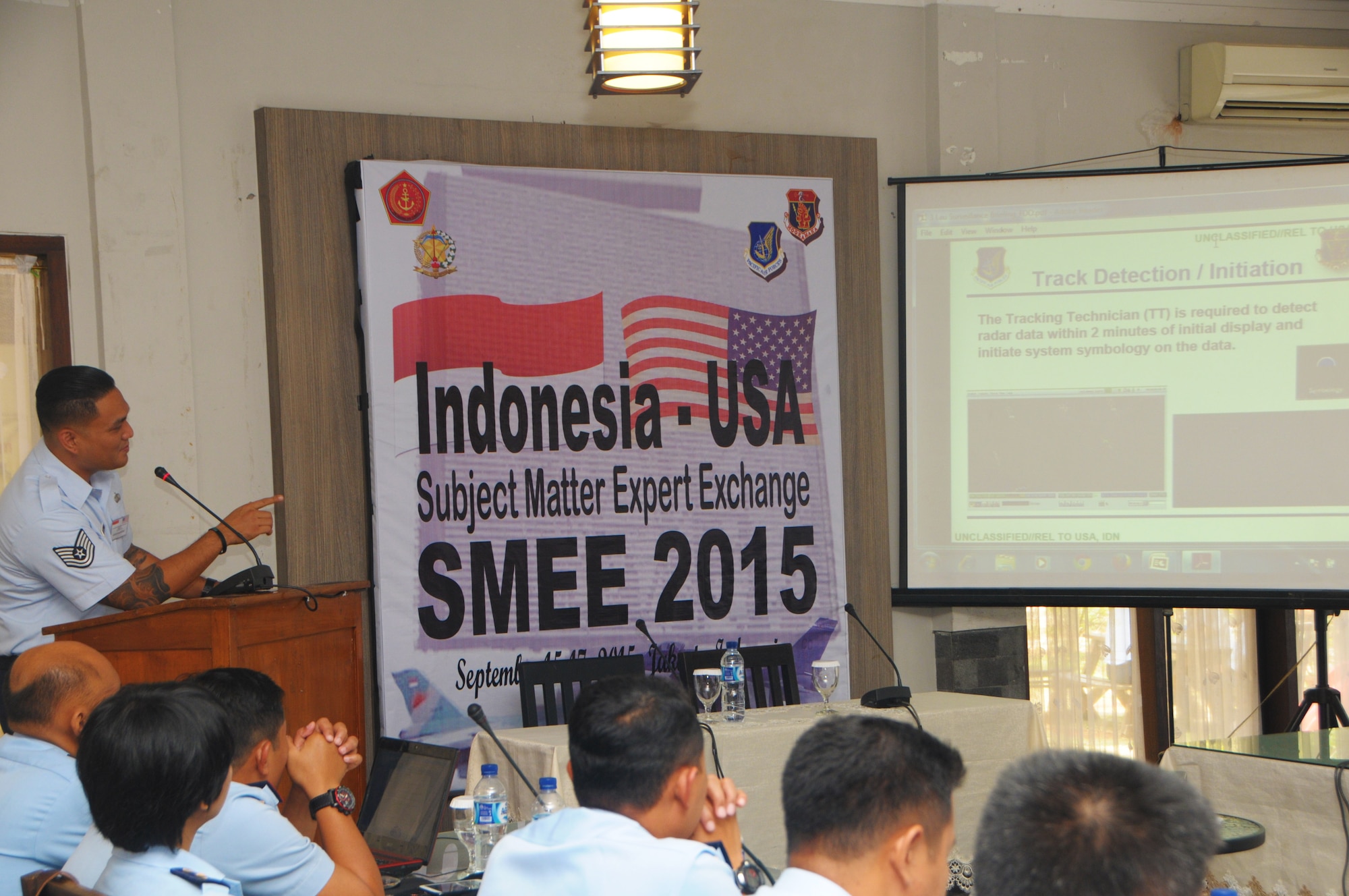 Tech. Sgt. Jacy Lau, an Air Surveillance Technician with the 169th Air Defense Squadron briefs track detection and initiation to members of Kohanudnas, the component of the Indonesian Armed Forces responsible for air defense, Sept. 16, 2015, Jakarta, Indonesia. As part of the National Guard's State Partnership Program, members of the HIANG participated in an air defense subject matter expert exchange with counterparts from Indonesia. (U.S. Air National Guard photo by Senior Airman Orlando Corpuz/released)
