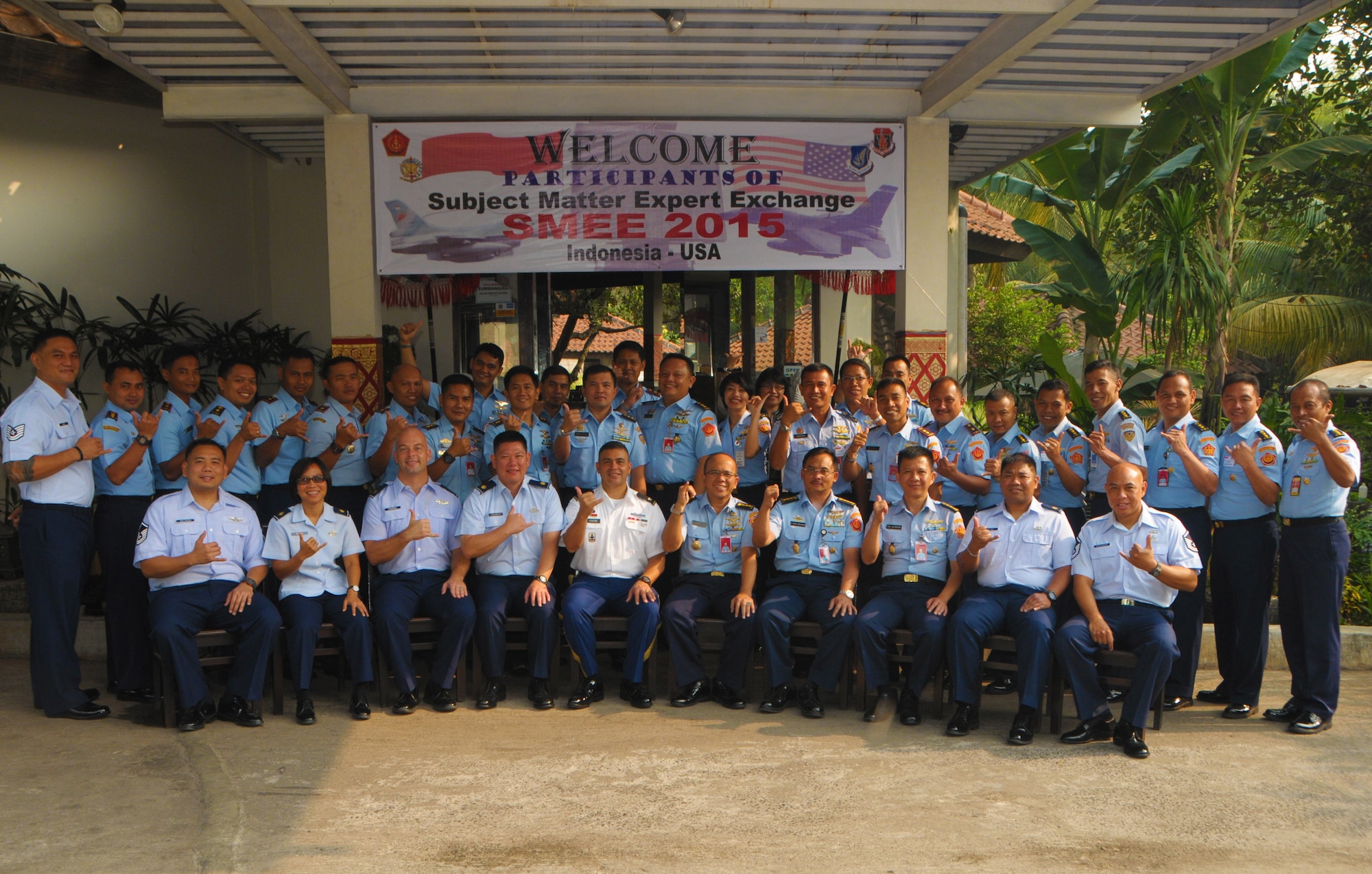 Hawaii Air and Army National Guard members flash the traditional "shaka" sign from Hawaii with members of Kohanudnas, Sept. 15, 2015, Jakarta, Indonesia. Kohanudnas is the air defense component of the Indonesian armed forces. As part of the National Guard's State Partnership Program, members of the HIANG participated in an air defense subject matter expert exchange with counterparts from Indonesia. (U.S. Air National Guard photo by Senior Airman Orlando Corpuz/released)
