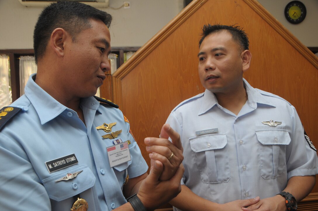 Master Sgt. Joseph Salvador, Hawaii Air National Guard State Partnership Program, speaks with Lt. Col. Satriyo Utomo from Kohanudnas, Sept. 15, 2015, Jakarta, Indonesia. Kohanudnas is the air defense component of the Indonesian armed forces. As part of the National Guard's State Partnership Program, members of the HIANG participated in an air defense subject matter expert exchange with counterparts from Indonesia. (U.S. Air National Guard photo by Senior Airman Orlando Corpuz/released)
