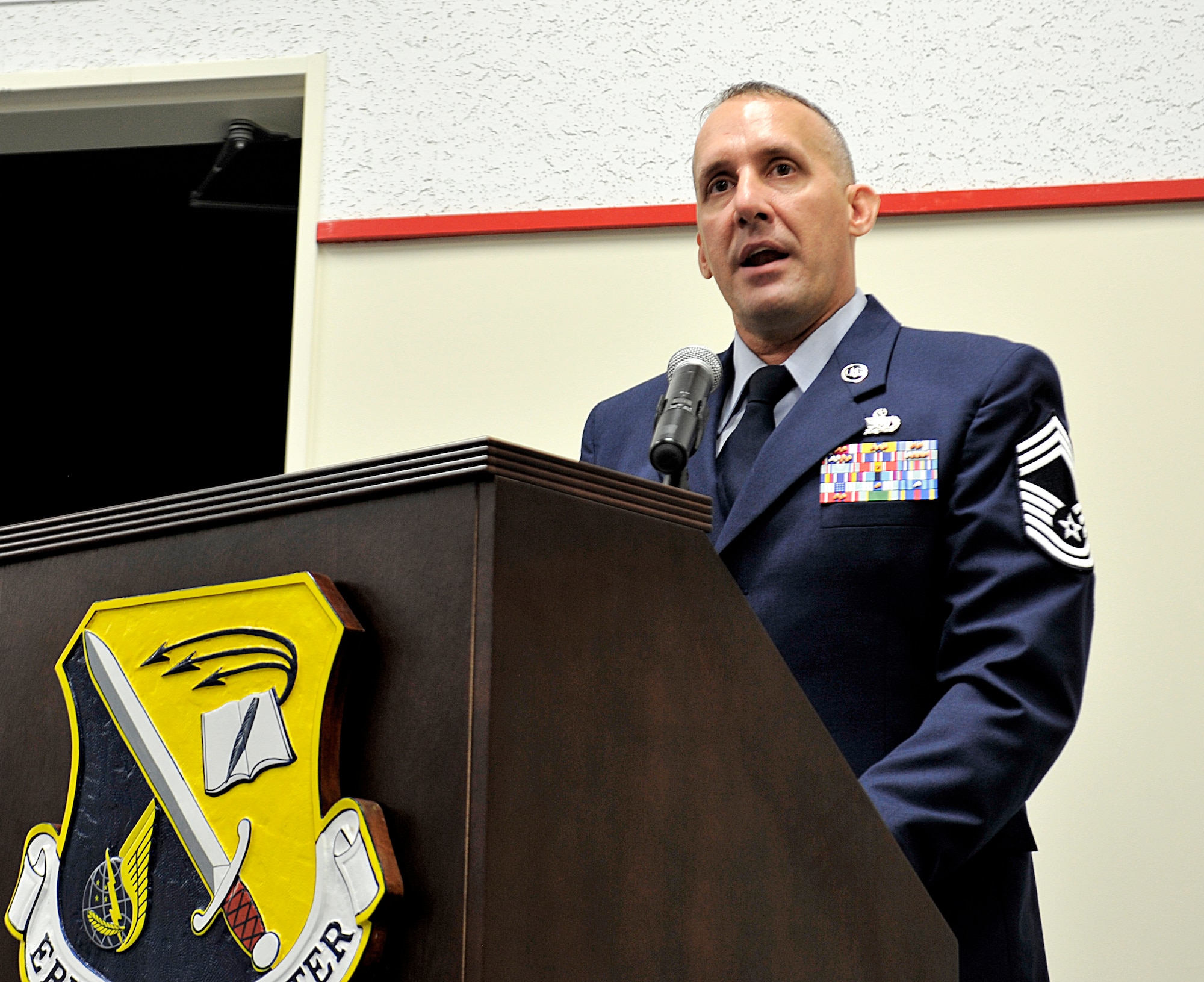 Special guest, U.S. Air Force Chief Master Sgt. Daniel Janssen, 18th Logistics Readiness Squadron superintendent, speaks about the importance of NCO leadership during the NCO Academy Class 15-6 graduation ceremony Sept. 24, 2015, on Kadena Air Base, Japan. Sixty nine students graduated from the six-week military leadership course readying them for NCO management roles and responsibilities. (U.S. Air Force photo by Naoto Anazawa)