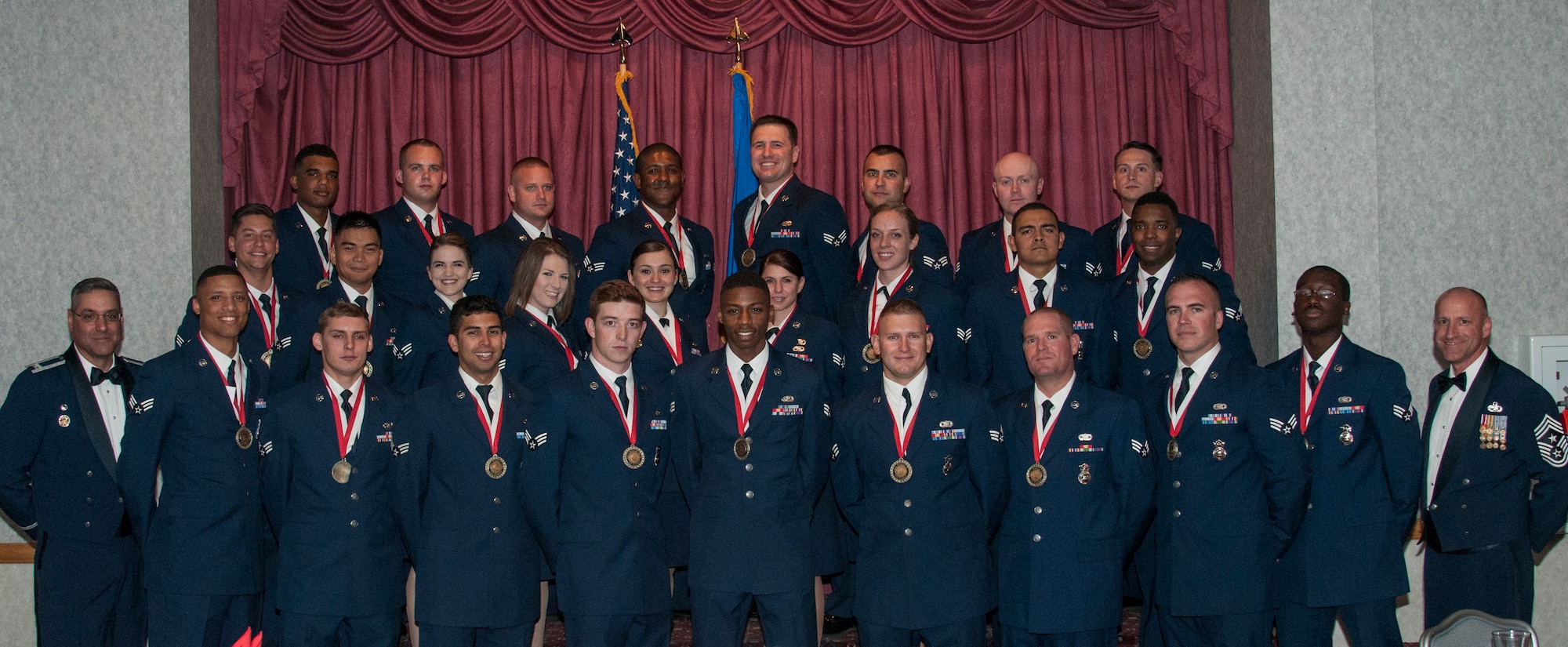 Col. Stephen Kravitsky, 90th Missile Wing commander and Chief Master Sgt. Samuel Couch, 90th MW command chief, pose for a photograph with the graduating ALS class 15-H in the Trail’s End Event Center Sept. 23, 2015. (U.S. Air Force photo by Senior Airman Jason Wiese)